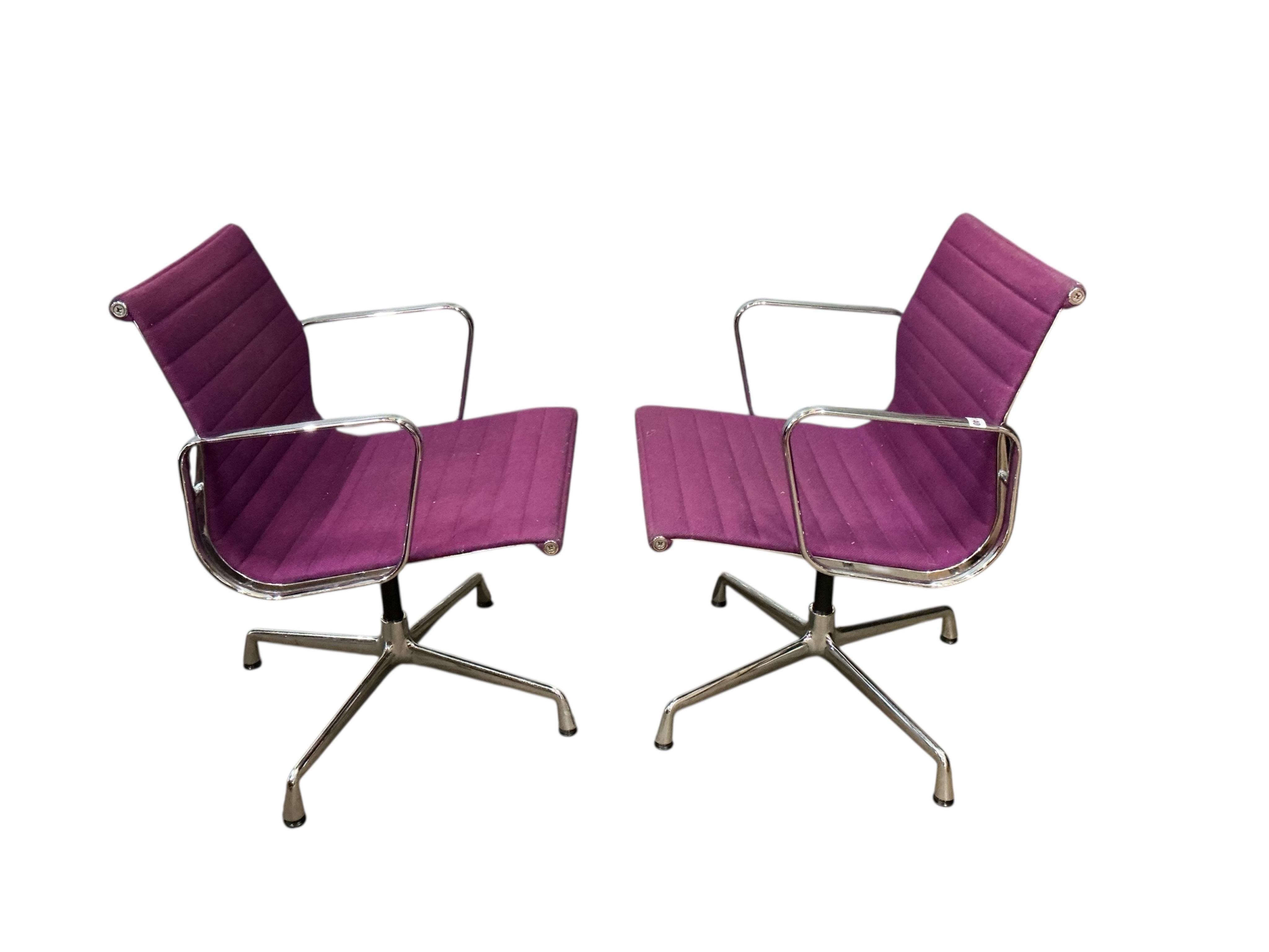 Charles Eames for Vitra, a pair of chrome swivel desk chairs on four prong bases, width 57cm, depth 50cm, height 82cm